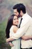 87-engaged-couple-embrace-kiss-on-head-smile-outdoors.jpg