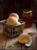 Round small bread and jar of honay.jpg