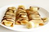 Crepes with banana slices and melted nuttela toping.jpg