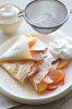 Crepes with fresh peaches, whipped cream and a dusting of confectioners sugar.jpg