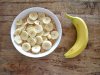 Oatmeal with banana slices and whole banana on the side.jpg