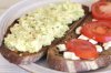 Mashed boiled eggs with avocado, mayo and mustard and tomatoes on a goat cheese.jpg