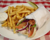 Chicken gyro sandwich with tartar and fries.png